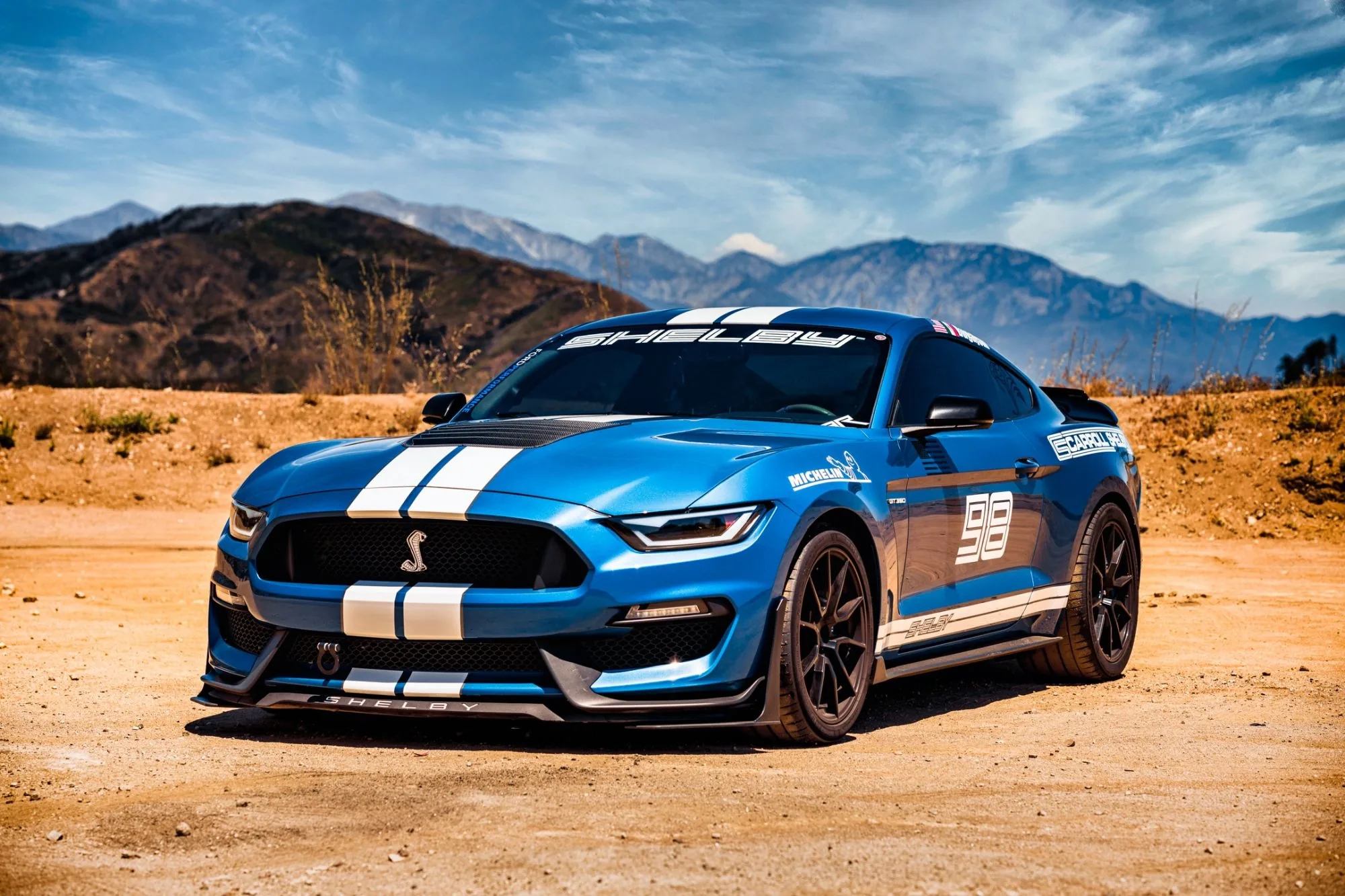 Blue Shelby Mustang GT350 in the mountains